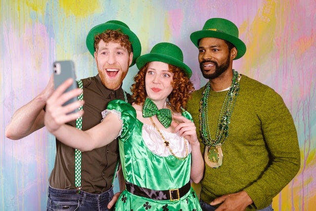 Friends sharing a laugh at a St. Patrick's Day gathering