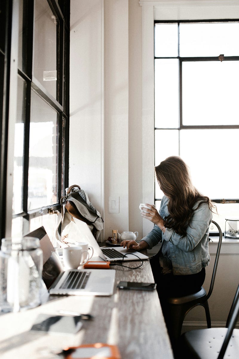 Woman triumphantly overcoming procrastination.