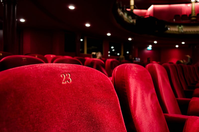 A serene movie theater, reflecting personal exploration