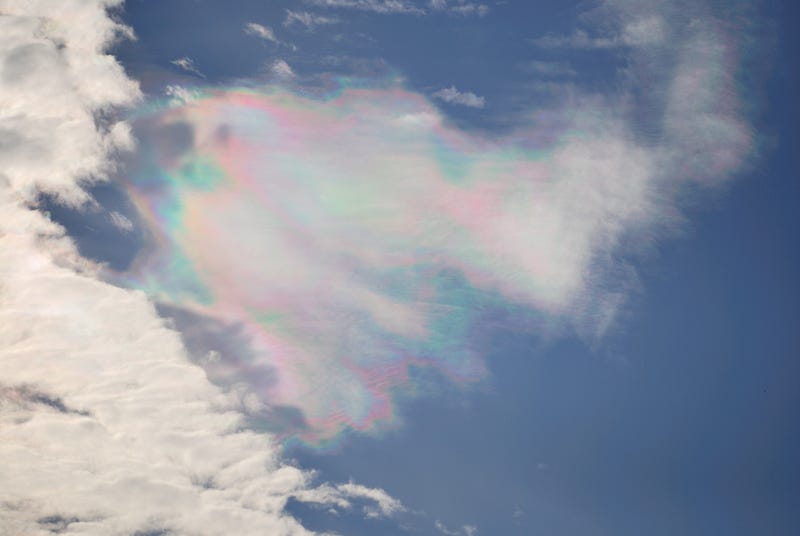 Iridescent clouds against a blue sky