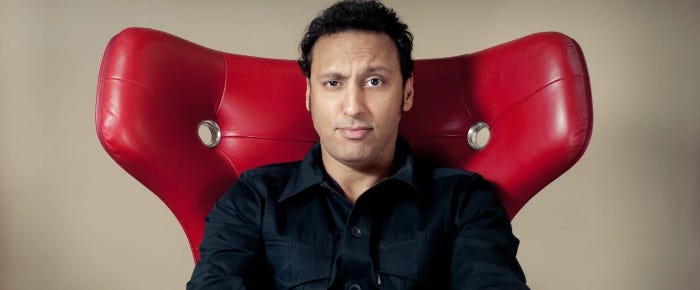 Aasif Mandvi as Ben Shakir, the tech expert of the group.